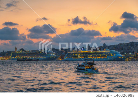 Istanbul, Turkiye - Sunset Over Bosphorus with Cruise Ships and Small Boat Istanbul, Turkiye - Sunset Over Bosphorus with Cruise Ships and Small Boat 140326988