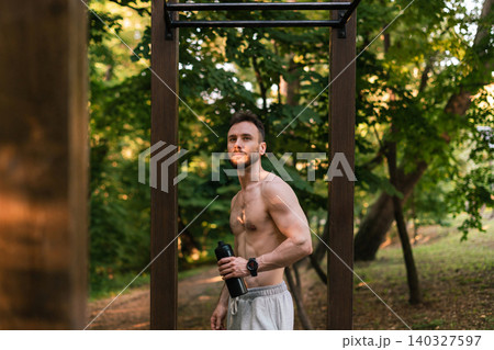 Man Taking Break during Outdoor Fitness Session 140327597