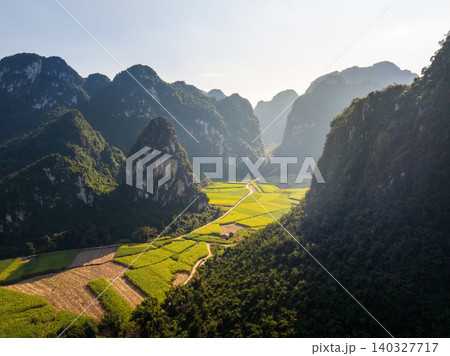 Breathtaking Aerial View of Lush Green Fields and Mountains in Guangxi, China Breathtaking Aerial View of Lush Green Fields and Mountains in Guangxi, China 140327717