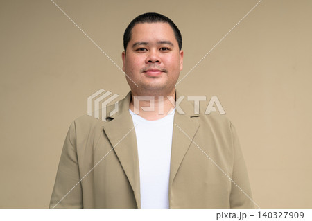 Confident plus size Isan Thai businessman portrait horizontal 140327909