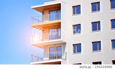 View of modern residential building with glass balconies and bright facade. Contemporary apartment building in european city. Concept of urban living and modern architecture.  140328066