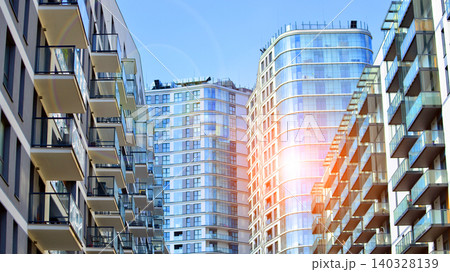 View of modern residential building with glass balconies and bright facade. Contemporary apartment building in european city. Concept of urban living and modern architecture.  140328139