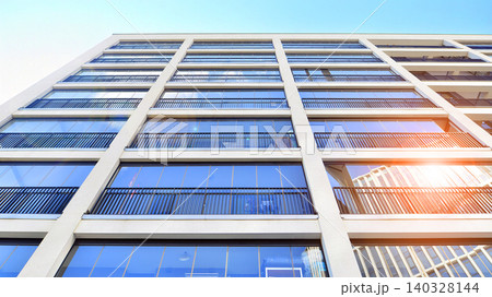 View of modern residential building with glass balconies and bright facade. Contemporary apartment building in european city. Concept of urban living and modern architecture.  140328144