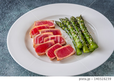 Perfectly Seared Yellowfin Tuna Steak With Asparagus And Sesame Seeds 140328239