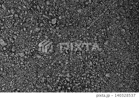 Surface of black freshly laid and rolled asphalt with distinguishable gravel fractions. Blank for artwork, texture materials for games and others 140328537