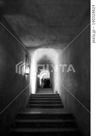 Tunnel stairs leading to mysterious light with people Tunnel stairs leading to mysterious light with people 140328624