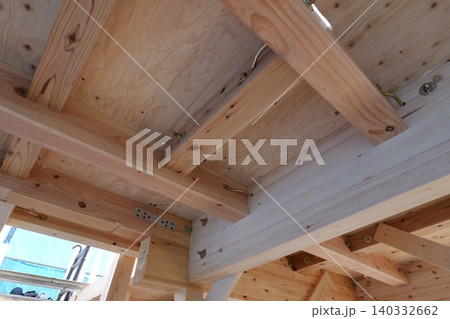 Timber Framing Structure of Residential Building at Construction Site, Low Angle View Timber Framing Structure of Residential Building at Construction Site, Low Angle View 140332662