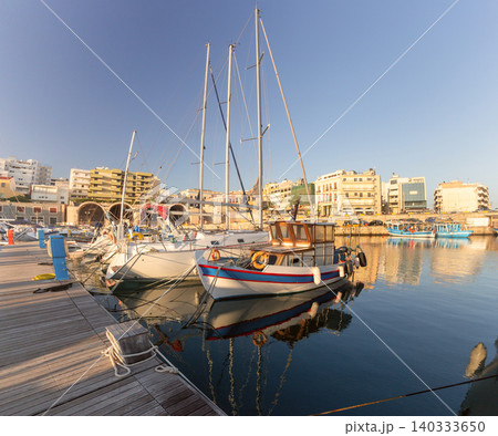 Fishing Boats and Sailing Yachts Moored in Heraklion Marina Crete Greece Fishing Boats and Sailing Yachts Moored in Heraklion Marina Crete Greece 140333650