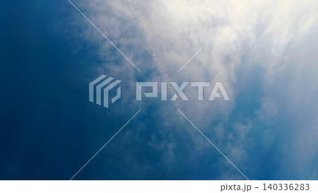 Blue Sky with White Clouds and Airplane Contrail - Clear Weather Background Blue Sky with White Clouds and Airplane Contrail - Clear Weather Background 140336283