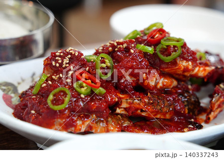 Spicy and sweet Korean marinated raw crab topped with chili and sesame seeds Spicy and sweet Korean marinated raw crab topped with chili and sesame seeds 140337243