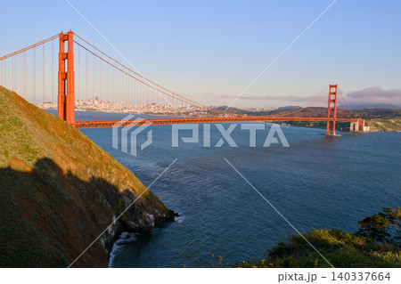 Golden Gate Bridge spanning San Francisco Bay from coastal hills 140337664