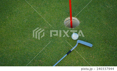 Golf balls on a green lawn in a beautiful golf course with morning sunshine. Golf balls on a green lawn in a beautiful golf course with morning sunshine. 140337944