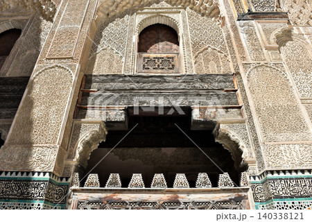Carved stone gate arch, carved wooden architectural details, Medersa bou Inania, Fez, Morocco 140338121