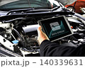 Mechanic diagnostics engine car using digital obd2 scanner tablet 140339631