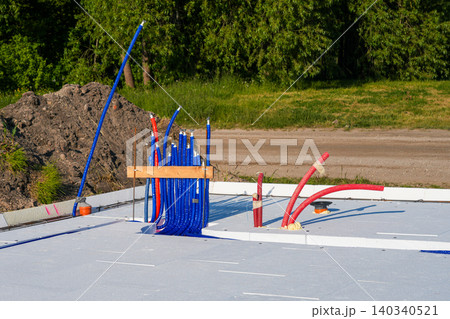 Underfloor heating manifold connections and utility outputs on insulated slab foundation construction Underfloor heating manifold connections and utility outputs on insulated slab foundation construction 140340521