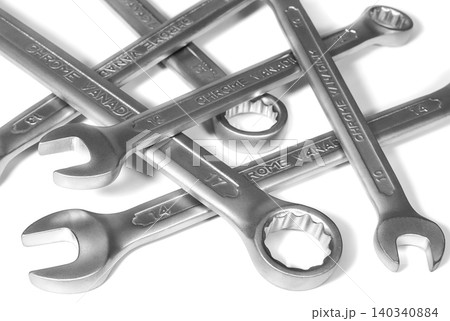 Heap of metal spanners on a white background Heap of metal spanners on a white background 140340884