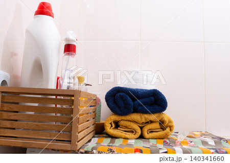 Toilet Paper, towels. Bathroom Essentials Stacked With Cleaning Supplies at home 140341660