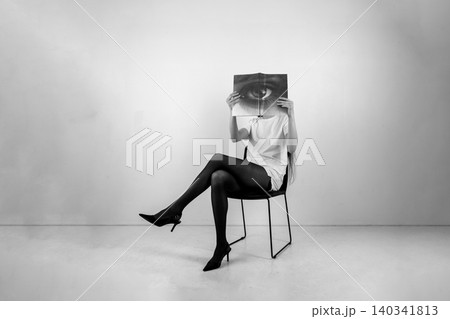 Woman hiding face with eye book conceptual identity Woman hiding face with eye book conceptual identity 140341813