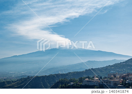 Mount Etna volcano emitting smoke above Taormina, Sicily, Italy Mount Etna volcano emitting smoke above Taormina, Sicily, Italy 140341874