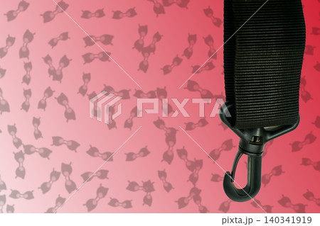 Clasp carabine for fastening with a textile strap on red gradient 140341919