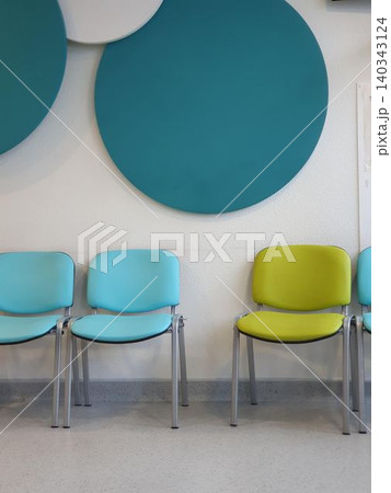 Blue and green chairs in hospital waiting area Blue and green chairs in hospital waiting area 140343124