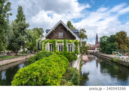 House covered with green ivy by the canal Strasbourg, France House covered with green ivy by the canal Strasbourg, France 140343266