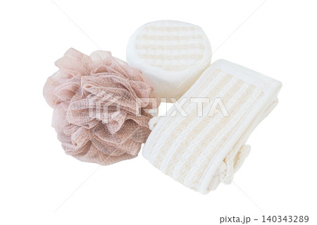 Beige washcloths and other accessories isolated on white background. Wash and cleaning. Care and hygiene. Top view. 140343289