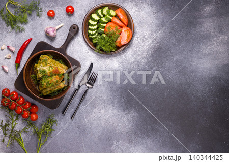 Homemade cabbage rolls with fresh vegetables and herbs Homemade cabbage rolls with fresh vegetables and herbs 140344425
