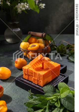 Apricot fruit candy blocks on black board Apricot fruit candy blocks on black board 140344440