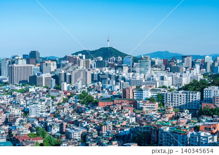 Panoramic view of downtown Seoul city skyline and Namsan Seoul Tower from Inwangsan Mountain on a clear summer day 140345654