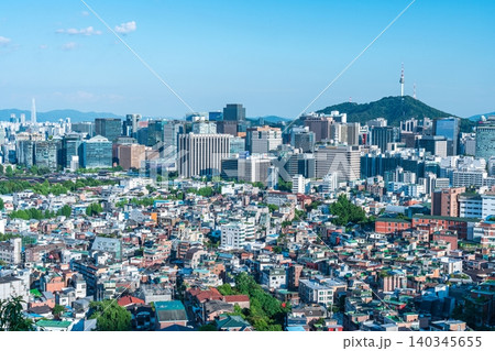 Panoramic view of downtown Seoul city skyline and Namsan Seoul Tower from Inwangsan Mountain on a clear summer day 140345655