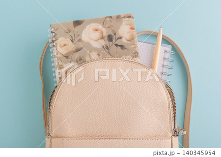 Backpack with notebook and pen for education supplies 140345954
