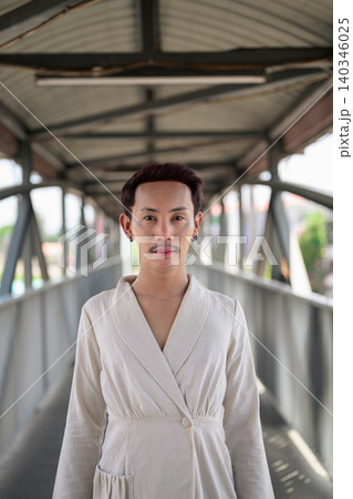 Vertical Symmetrical Portrait of Thai Non-Binary Gay Man on Footbridge Vertical Symmetrical Portrait of Thai Non-Binary Gay Man on Footbridge 140346025
