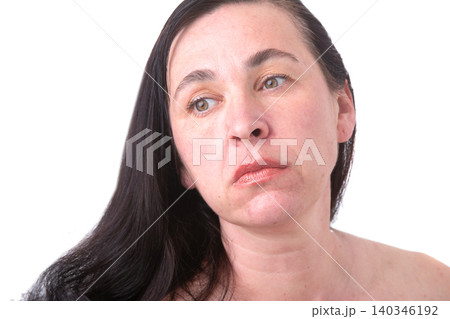 Portrait of a woman close -up with wrinkles and age -related facial changes after forty years 140346192