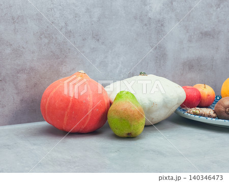 Autumn harvest displaying fresh produce on rustic background 140346473
