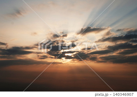 Golden bright evening sunset sky with clouds 140346907