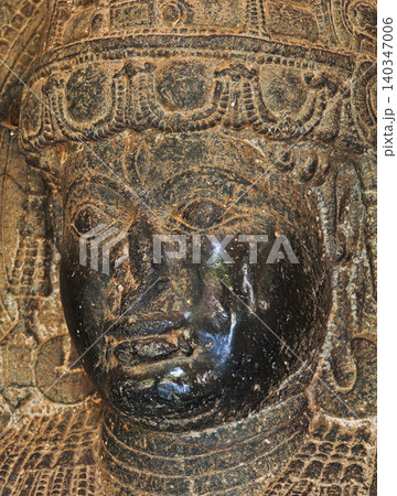 Close-up View on Shaivite Dvarapala Isdoor Or Gate Guardian Often Portrayed As Warrior Or Fearsome Giant, Usually Armed With Weapon - Most Common Being The Gada -mace- 140347006