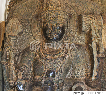 Close-up View on Shaivite Dvarapala Isdoor Or Gate Guardian Often Portrayed As Warrior Or Fearsome Giant, Usually Armed With Weapon - Most Common Being The Gada -mace- 140347053