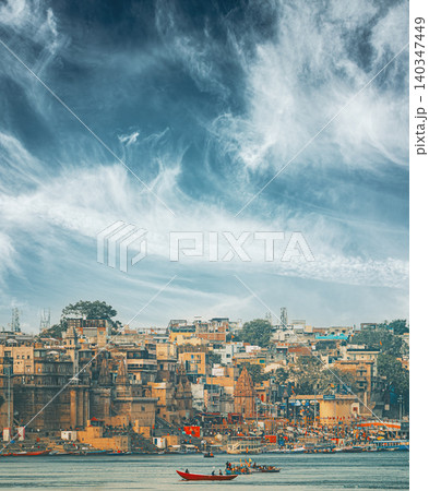 Varanasi Skyline Under Dramatic Clouds. Boats Floating Near Rana Mahal Ghat, Darbhanga Ghat And Dashashwamedh Ghat 140347449