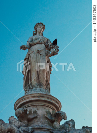 Mumbai, India. Bird Perched on Flora Fountain Statue Mumbai, India. Bird Perched on Flora Fountain Statue 140347602