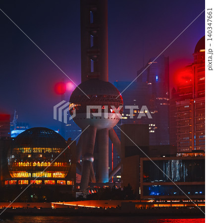 Oriental Pearl Tower glowing purple at night in Shanghai skyline. Oriental Pearl Tower glowing purple at night in Shanghai skyline. 140347661