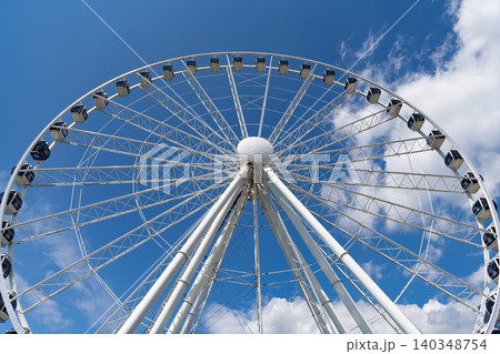 Seattle, Washington, USA, July 25, 2024: Observation Ferris wheel. Fairground ride on observation wheel. Entertainment park. Ferris wheel. Amusement park with Ferris wheel. Low angle Seattle, Washington, USA, July 25, 2024: Observation Ferris wheel. Fairground ride on observation wheel. Entertainment park. Ferris wheel. Amusement park with Ferris wheel. Low angle 140348754