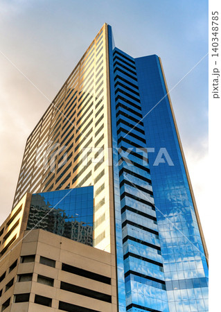Perspective city skyscraper. Business skyscraper building. Architectural building in business area. Modern city. Glass skyscraper. City architecture. Modern office building Perspective city skyscraper. Business skyscraper building. Architectural building in business area. Modern city. Glass skyscraper. City architecture. Modern office building 140348785