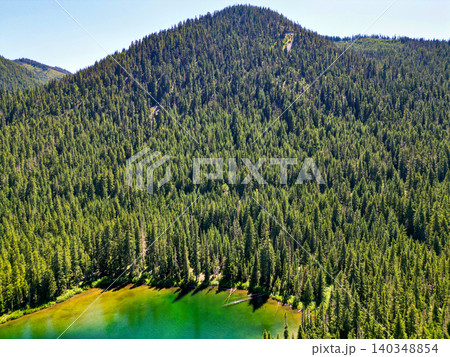 Cooper lake with mountain landscape. Landscape of mountain and forest of Cooper lake. Nature landscape. Cooper Lake in Washington. Scenic nature of popular hiking Cooper lake Cooper lake with mountain landscape. Landscape of mountain and forest of Cooper lake. Nature landscape. Cooper Lake in Washington. Scenic nature of popular hiking Cooper lake 140348854