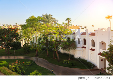 Luxury hotel architecture and elegant courtyard in an Arabian country with traditional design and modern amenities Luxury hotel architecture and elegant courtyard in an Arabian country with traditional design and modern amenities 140349063