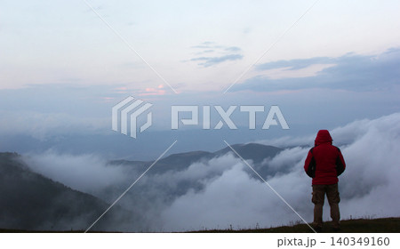 Rear view of male tourist. Enjoying the magnificent view. Rear view of male tourist. Enjoying the magnificent view. 140349160