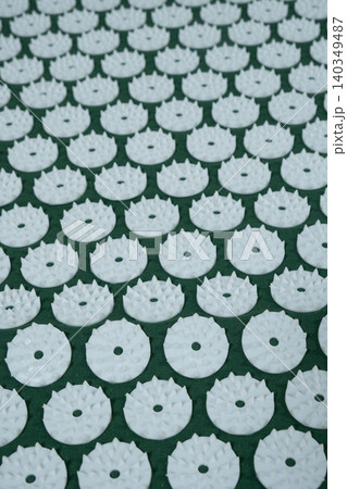 Macro abstract background of green acupuncture massage mat needles. 140349487