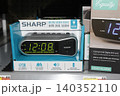 SHARP Digital Alarm Clock in a box on a shelf closeup SHARP Digital Alarm Clock in a box on a shelf closeup 140352110