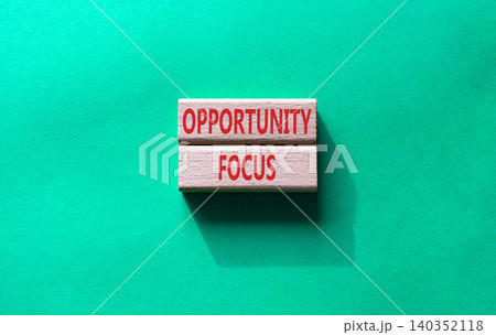 Opportunity focus symbol. Concept word Opportunity focus on wooden blocks. Beautiful green background. Business and Opportunity focus concept. Copy space 140352118