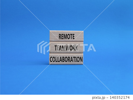Remote teamwork collaboration symbol. Concept word Remote teamwork collaboration on wooden blocks. Beautiful blue background. Business and Remote teamwork collaboration. Copy space 140352174